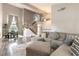 Open-concept living room with dining area, staircase, and comfortable seating at 730 Rusty Spur Dr, Henderson, NV 89014