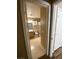 A view through the doorway of a bathroom with neutral walls and floors at 7564 Durham Hall Ave # 201, Las Vegas, NV 89130