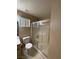 This bathroom features a shower and toilet with neutral walls at 7564 Durham Hall Ave # 201, Las Vegas, NV 89130