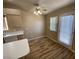 The dining area includes laminate floors, modern ceiling fan, and door to access outside at 7564 Durham Hall Ave # 201, Las Vegas, NV 89130