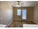 The dining area has modern ceiling fan, laminate floors, and a door that leads outside at 7564 Durham Hall Ave # 201, Las Vegas, NV 89130