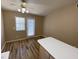 The dining area includes laminate floors, modern ceiling fan, and door to access outside at 7564 Durham Hall Ave # 201, Las Vegas, NV 89130