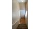 Entryway features a white front door, closet, and neutral-toned flooring and stairs at 7564 Durham Hall Ave # 201, Las Vegas, NV 89130