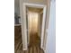 Hallway leading to carpeted room, view from the dining area of the home at 7564 Durham Hall Ave # 201, Las Vegas, NV 89130