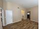 Bright living room features hardwood floors, neutral paint, and recessed lighting at 7564 Durham Hall Ave # 201, Las Vegas, NV 89130