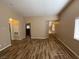 Inviting living room features hardwood floors, neutral paint, and large windows at 7564 Durham Hall Ave # 201, Las Vegas, NV 89130