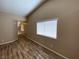 Well-lit living room boasts hardwood floors and neutral walls at 7564 Durham Hall Ave # 201, Las Vegas, NV 89130