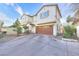 Charming two-story home featuring a spacious driveway and attached two-car garage at 759 Sunrise Crossing St, Henderson, NV 89014