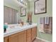 Bathroom featuring a double sink vanity and a shower-tub combination with modern fixtures at 7950 W Flamingo Rd # 1003, Las Vegas, NV 89147