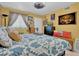 Inviting bedroom showcasing a decorative bed, soft lighting, and a view to the window at 7950 W Flamingo Rd # 1003, Las Vegas, NV 89147