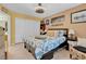 Comfortable bedroom featuring a ceiling fan, neutral colors, and closet for ample storage at 7950 W Flamingo Rd # 1003, Las Vegas, NV 89147