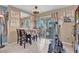 Cozy dining area with tile flooring and access to an outdoor patio at 7950 W Flamingo Rd # 1003, Las Vegas, NV 89147