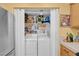Laundry Room showcases a washer and dryer within a closet, and a stainless steel refrigerator at 7950 W Flamingo Rd # 1003, Las Vegas, NV 89147