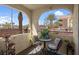 Charming outdoor patio with comfortable seating and peaceful neighborhood views from second story at 7950 W Flamingo Rd # 1003, Las Vegas, NV 89147