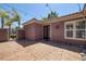 Covered back patio featuring decorative lights, windows, and sliding glass doors at 8209 Chapelle Ct, Las Vegas, NV 89131