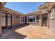 Covered back patio featuring decorative lights, windows, and access to the home at 8209 Chapelle Ct, Las Vegas, NV 89131