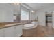 Spacious bathroom featuring dual sinks, a soaking tub, and a separate tiled shower at 8209 Chapelle Ct, Las Vegas, NV 89131