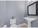Stylish powder room with pedestal sink and modern accents at 8209 Chapelle Ct, Las Vegas, NV 89131