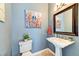 Stylish powder room with pedestal sink and modern accents at 8209 Chapelle Ct, Las Vegas, NV 89131