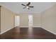 Bedroom boasts wood floors, neutral walls, ceiling fan and ample natural light at 8209 Chapelle Ct, Las Vegas, NV 89131