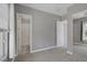 Bedroom featuring carpet, a ceiling fan, and a bathroom through the door at 8209 Chapelle Ct, Las Vegas, NV 89131