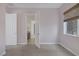 Bright bedroom with a carpeted floor and an open door to the bathroom at 8209 Chapelle Ct, Las Vegas, NV 89131