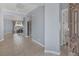 Open-concept foyer featuring tile flooring, light blue walls, and an ornate metal gate at 8209 Chapelle Ct, Las Vegas, NV 89131
