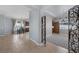 Open-concept foyer featuring tile flooring, light blue walls, and an ornate metal gate at 8209 Chapelle Ct, Las Vegas, NV 89131