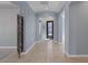 Spacious foyer featuring tile flooring, an ornate metal gate, and access to various rooms at 8209 Chapelle Ct, Las Vegas, NV 89131