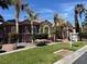 Beautiful single-story home featuring manicured landscaping, stone accents, and a tile roof at 8209 Chapelle Ct, Las Vegas, NV 89131