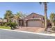 Beautiful single-story home featuring desert landscaping, stone accents, and a two-car garage at 8209 Chapelle Ct, Las Vegas, NV 89131