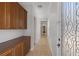 Hallway with cabinets on the left and a decorative glass door at the end at 8209 Chapelle Ct, Las Vegas, NV 89131
