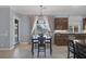 Open kitchen featuring granite counters, dark wood cabinets and a beautiful view of the pool at 8209 Chapelle Ct, Las Vegas, NV 89131