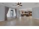 Open floor plan with a view of the kitchen and floor to ceiling windows letting in natural light at 8209 Chapelle Ct, Las Vegas, NV 89131