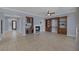 Bright living room with fireplace, built in shelves and tile flooring throughout at 8209 Chapelle Ct, Las Vegas, NV 89131