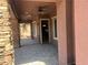 Inviting covered patio with stone accents, ceiling fan, recessed lighting, and outdoor access at 8209 Chapelle Ct, Las Vegas, NV 89131