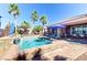 The home features a pool and spa along with patio furniture and palm trees at 8209 Chapelle Ct, Las Vegas, NV 89131
