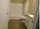 Bathroom with neutral color scheme, tiled floors and shower-tub combo at 8250 N Grand Canyon Dr # 1121, Las Vegas, NV 89166