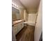 Standard bathroom features a shower-tub combo, white vanity, and neutral color scheme at 8250 N Grand Canyon Dr # 1121, Las Vegas, NV 89166