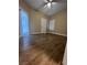 A bright bedroom with tiled floors, a ceiling fan, and shutters on the window at 8250 N Grand Canyon Dr # 1121, Las Vegas, NV 89166