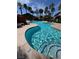 Beautiful community pool with lush landscaping and a waterfall feature for a relaxing atmosphere at 8250 N Grand Canyon Dr # 1121, Las Vegas, NV 89166