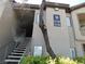 Exterior view of a condo building featuring stairs leading to the units at 8250 N Grand Canyon Dr # 1121, Las Vegas, NV 89166