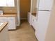 Bright kitchen with white cabinets, tiled floors and modern appliances at 8250 N Grand Canyon Dr # 1121, Las Vegas, NV 89166