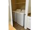 Laundry area featuring a modern white washer and dryer at 8250 N Grand Canyon Dr # 1121, Las Vegas, NV 89166