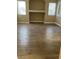 A large living room area featuring tile floors, built-in shelves and plenty of natural light at 8250 N Grand Canyon Dr # 1121, Las Vegas, NV 89166
