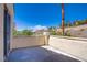 A balcony featuring stucco walls, a metal railing, and an elevated view of the beautiful landscape and blue sky at 830 Binbrook Dr, Henderson, NV 89052