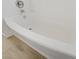 Close-up of a clean, white bathtub with chrome fixtures and a modern design at 830 Binbrook Dr, Henderson, NV 89052