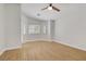 Spacious bedroom with laminate flooring, ceiling fan, and generous natural light at 830 Binbrook Dr, Henderson, NV 89052