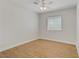 Bedroom with wood flooring, ceiling fan, and a bright window with blinds at 830 Binbrook Dr, Henderson, NV 89052