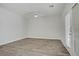Bright bedroom featuring neutral paint, fan, and patio access at 830 Binbrook Dr, Henderson, NV 89052